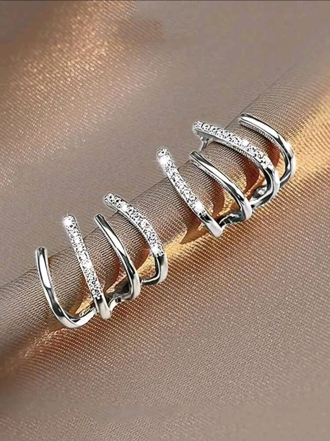 Aretes de garra triple argollas