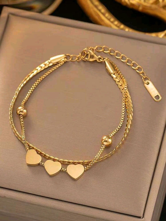 Pulsera dorada capa doble diseño de corazones